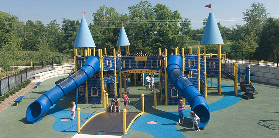 Children play on a castle themed playground.